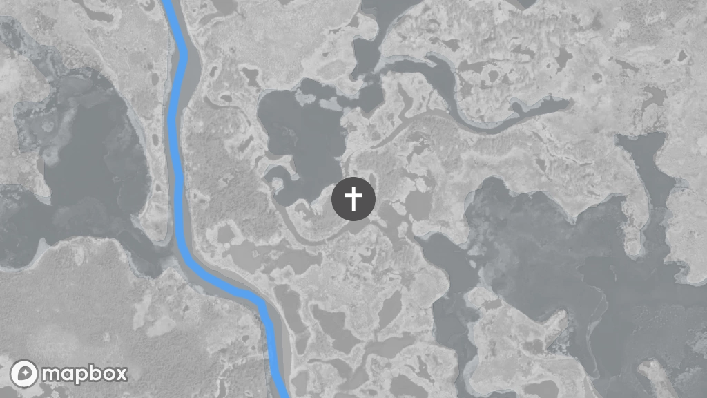 A satellite image of a gravesite located on the shore of a small lake east of the Marian River.